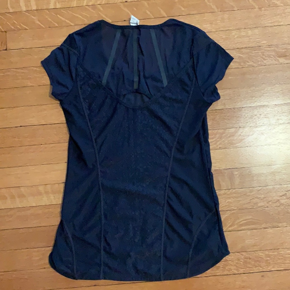 Navy workout top with mesh and cutout in the back